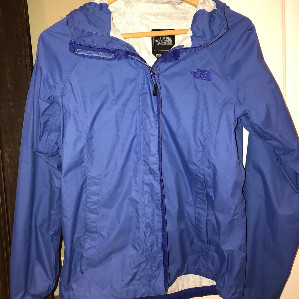 Blue and white North Face rain jacket
